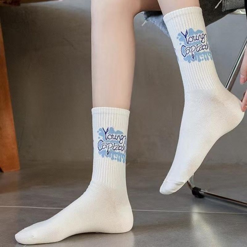 ถุงเท้าสตรีท ข้อยาว ลายกราฟฟิตี้ ผ้าCOTTON สีพื้น ผ้ายืด หลากสีStreet Style White Socks Graffiti Stockings Mens and Womens Socks